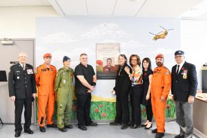 **HONOURING A NATIVE SON OF KELLIGREWS---The first ever Remembrance Day ceremonies held at Admirals Academy in Kelligrews last Wednesday were capped with the dedication of the school’s learning commons to the late Darrell Cronin, a Search and Rescue technician who was killed along with five other SAR Tecs 20 years ago in a helicopter crash in Northern Quebec. On hand for the ceremony were from left: the organizer of the event, Wayne Miller, who is an honourary colonel in the Canadian Forces; SAR Tec Scott Elliston, the commander of 9 Wing Gander air force base Lieut. Col. Jenn Weissenborn: Cronin’s brothers Keith Cronin and Curtis Cronin, Cronin’s widow Melinda Patton, school principal Nancy Healey, SAR Tec Gus Ryan and former CBS Mayor Woodrow French.**